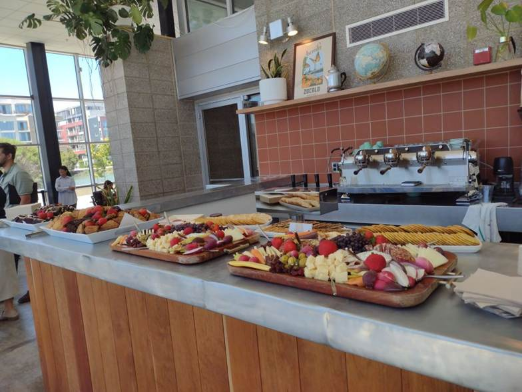 Before the crowds descended, four trays of tempting treats, including charcuterie and cheese, cookies and cake, were spread upon the counter at Zocalo Coffee. Photo by Bettina Cohen