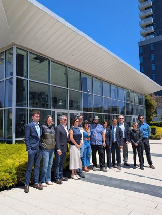 City officials, including Supervisor Matt Dorsey, third from left, pose with Zocalo owner Sara Ubelhart, center, Dan Grace (in cap and black jeans next to Sara), and neighborhood leaders. Photo by Anonymous Reader